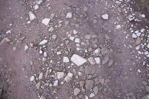 Background of shattered stony stones surface in mountain area. Texture with natural light photo