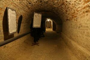 TERNOPIL, UKRAINE - AUGUST 23, 2023 The museum of tortures on territory of Zbarazh ancient castle in underground cellar photo