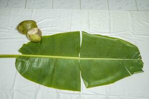 Banana leaf with line texture on white background photo