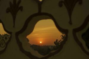 Gorgeous scenery of the strong dusky sunset and cloud on orange sky photo