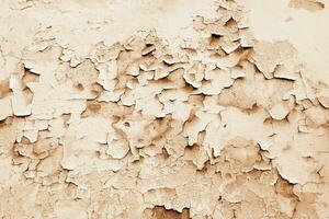 Texture background cracked peeling paint plaster. Wallpaper photo