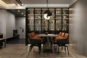 Glass door wall unit with stone background, Black and brown Comfy Chairs with Table in the dining room, 3D rendering photo