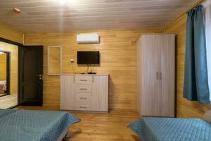 interior of wooden eco bedroom in studio apartments,  hostel or homestead photo