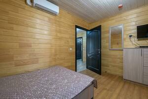 interior of wooden eco bedroom in studio apartments,  hostel or homestead photo