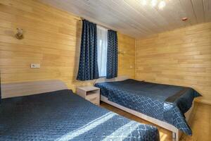 interior of wooden eco bedroom in studio apartments,  hostel or homestead photo