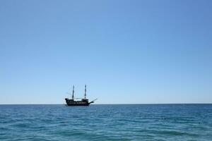 ANTALYA, TURKEY - MAY 15, 2021 Excursion Kemer pirate Boat Tour Monster on the Turkish Mediterranean. photo