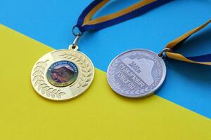 KYIV, UKRAINE - MAY 4, 2022 Medal for the person who conquered Mount Hoverla photo