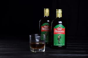 KHARKOV, UKRAINE - DECEMBER 3, 2020 Altmeister original liqueur bottle on dark black background. Elite alcohol photo