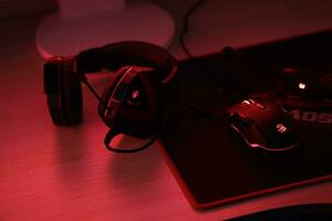 KYIV, UKRAINE - JULY 7, 2023 A4Tech Bloody G501 gaming headphones with microphone on table photo