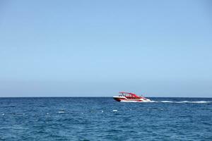 ANTALYA, TURKEY - MAY 15, 2021 Luxurious inflatable rib speed boat cruising in mediterranean deep sea photo