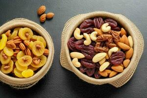 Dried fruits and nuts mixed in a bowl. background. AI Generative Pro Photo