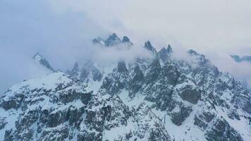 Cadini di Misurina Mountains on Cloudy Winter Day. Aerial View. Sexten Dolomites, Belluno, Italy. Orbiting video