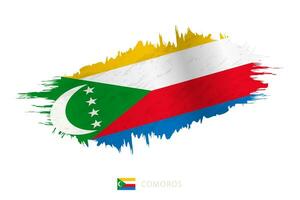 Painted brushstroke flag of Comoros with waving effect. vector
