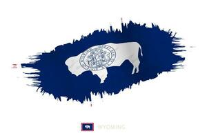 pintado pincelada bandera de Wyoming con ondulación efecto. vector