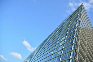 Urban abstract - windowed wall of office building. Detail shot of modern business building in city. photo