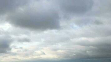 dramatic seascape, panorama downwards, dark clouds reflected in sea water, smooth sea surface video