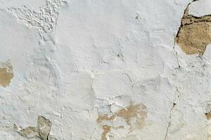 white plastered wall with broken part as background photo