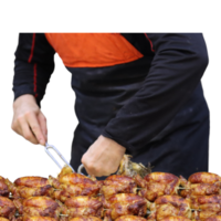 Hawkish rotisserie attendant cuts and serves grilled chicken- png