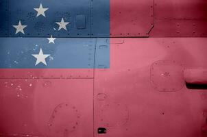 Samoa flag depicted on side part of military armored helicopter closeup. Army forces aircraft conceptual background photo