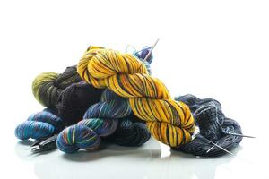 Colored threads, knitting needles and other items for hand knitting photo