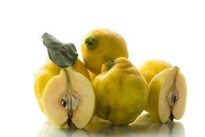 Ripe natural autumn quince on a white background. photo