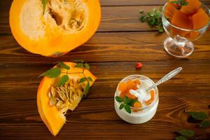 Homemade yogurt with pieces of pumpkin marmalade. photo