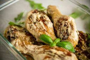 grilled chicken legs fried with spices in garlic sauce photo