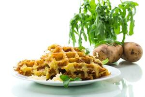 fried potato waffles with cheese in a plate on white background photo