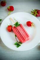 cooked homemade strawberry ice cream on a stick photo