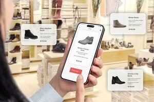 Trendy footwear in a shoe shop. Online app on a smartphone with a buy now button. Floating balloons suggesting shoe recommendations photo