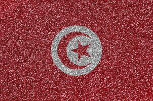 Tunisia flag depicted on many small shiny sequins. Colorful festival background for party photo