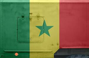 Senegal flag depicted on side part of military armored truck closeup. Army forces conceptual background photo