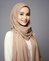 Beautiful asian girl wearing long hijab standing in plain background AI generative photo