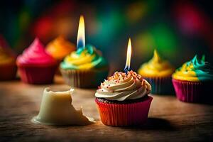 a group of cupcakes with candles on a table. AI-Generated photo