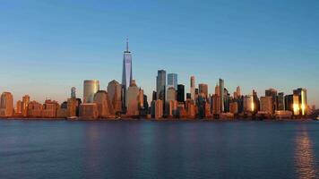 Lower Manhattan, New York City at Sunset. Aerial View. United States of America. Sun Flare on Skyscrapers. Drone Flies Upwards video