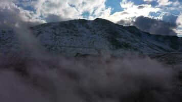 Snowy Mount Evans. Aerial View. Colorado, USA. Drone Flies Forward through Clouds video