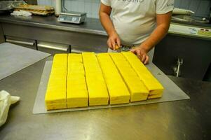 A chef cutting cakes photo