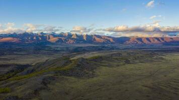 Kurai Steppe and Kurai Mountain Ridge at Sunset. Altai Mountains, Russia. Drone Hyper Lapse, Time Lapse video