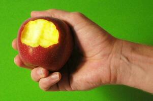 Hand holding an apple photo