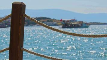 Boat Moving Behind Fishing Rope on the Pier on the Beach Footage. video