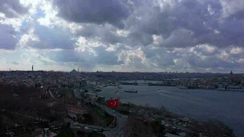 Beyoglu and Fatih Districts of Istanbul on Cloudy Day in Spring. Golden Horn and Galata Bridge. Aerial View. Drone Flies Upwards and Sideways video