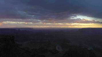 Dead Horse Point State Park at Sunset. Colorado River and Stormy Sky. Utah, USA. Aerial View from Meander Overlook. Drone Flies Sideways video