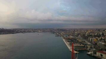 Beyoglu and Fatih Districts of Istanbul on Cloudy Morning in Spring. Turkey. Aerial View. Drone Flies Forward and Upwards over Bosphorus video