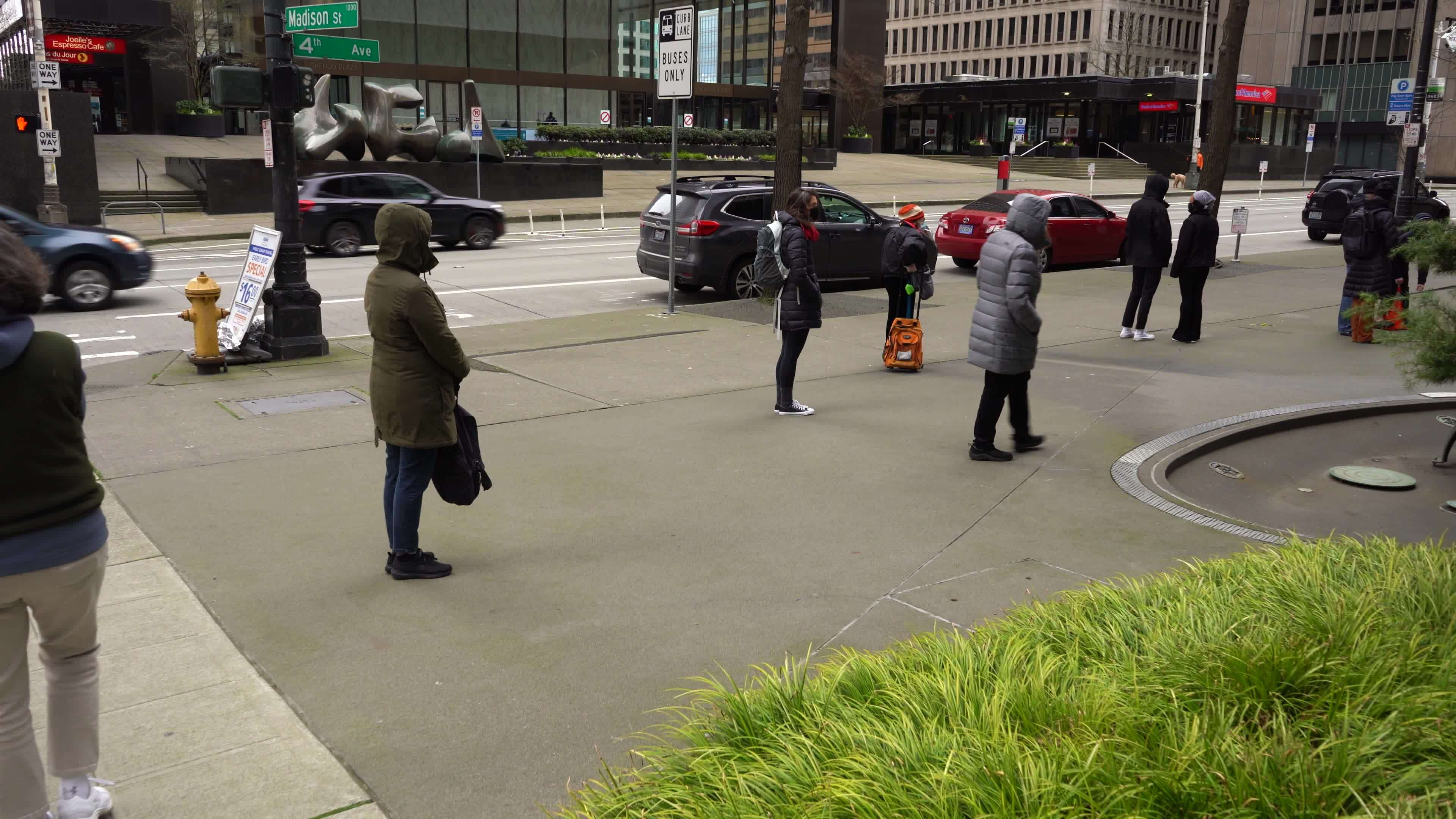 SEATTLE, USA FEBRUARY 4, 2021 People Wearing Masks are Lined Up and