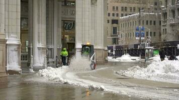 CHICAGO, USA - JANUARY 28, 2021 Sidewalk Snow Plowing by Snow Removal Vehicle on a Winter Day. Street Clearing video