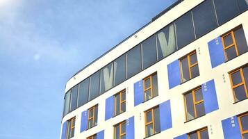 Condominium and apartment building with  symmetrical modern architecture in the city downtown. photo