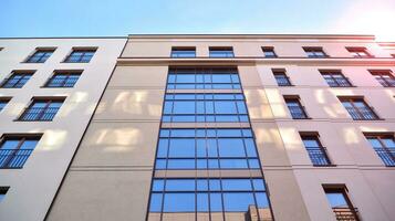 Condominium and apartment building with  symmetrical modern architecture in the city downtown. photo