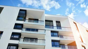 Condominium and apartment building with  symmetrical modern architecture in the city downtown. photo