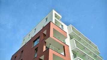 Condominium and apartment building with  symmetrical modern architecture in the city downtown. photo