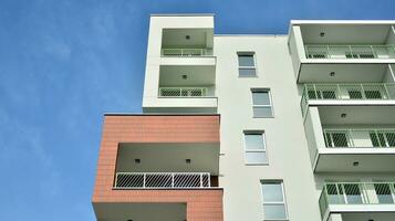 Condominium and apartment building with  symmetrical modern architecture in the city downtown. photo